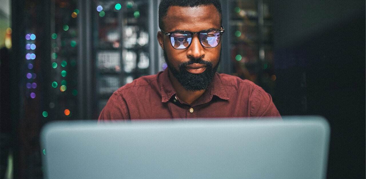 black-man-looking-at-computer-at-night-min.jpg