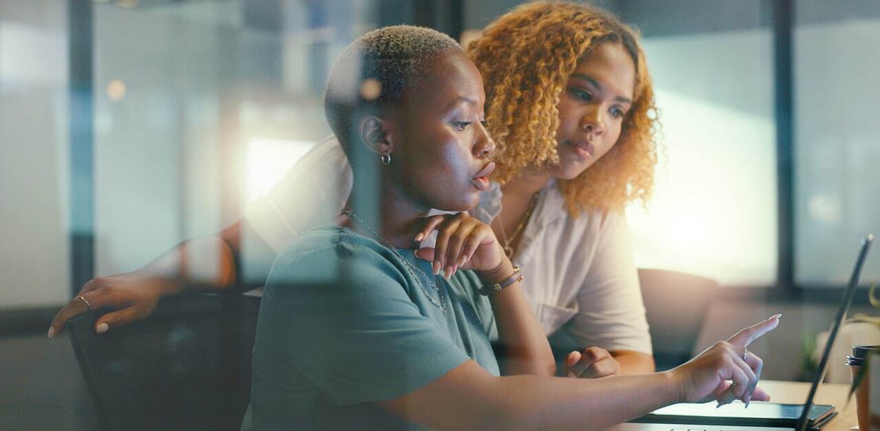 two-woman-looking-at-laptop-min.jpg